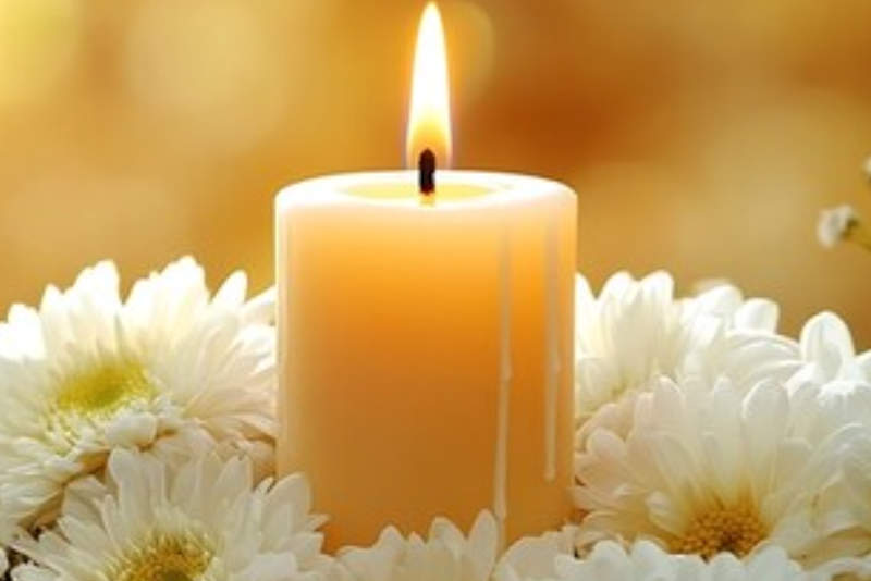 White flowers with gold candle